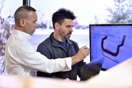 Mike Farber and Karl Schwenk looking at computer screen